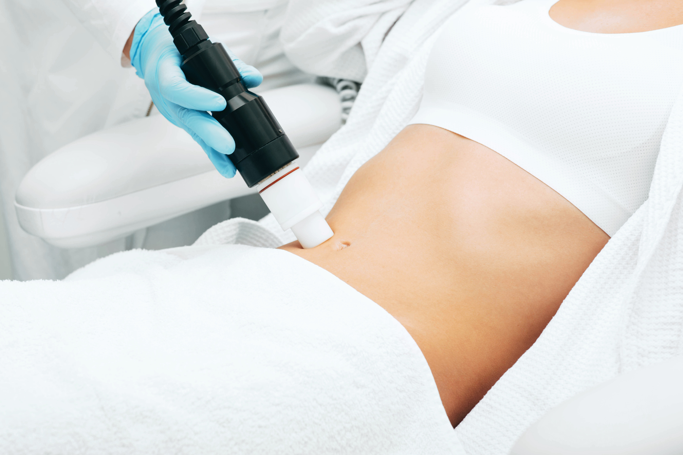 Acoustic wave therapy remove skin stretch marks on female belly. Remove of skin stretch marks after childbirth